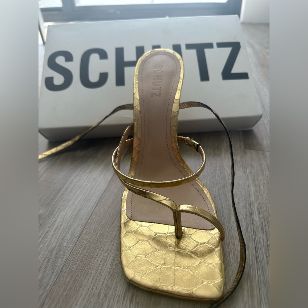 Metallic gold Schutz tie up heels